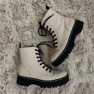 White and black combat boots